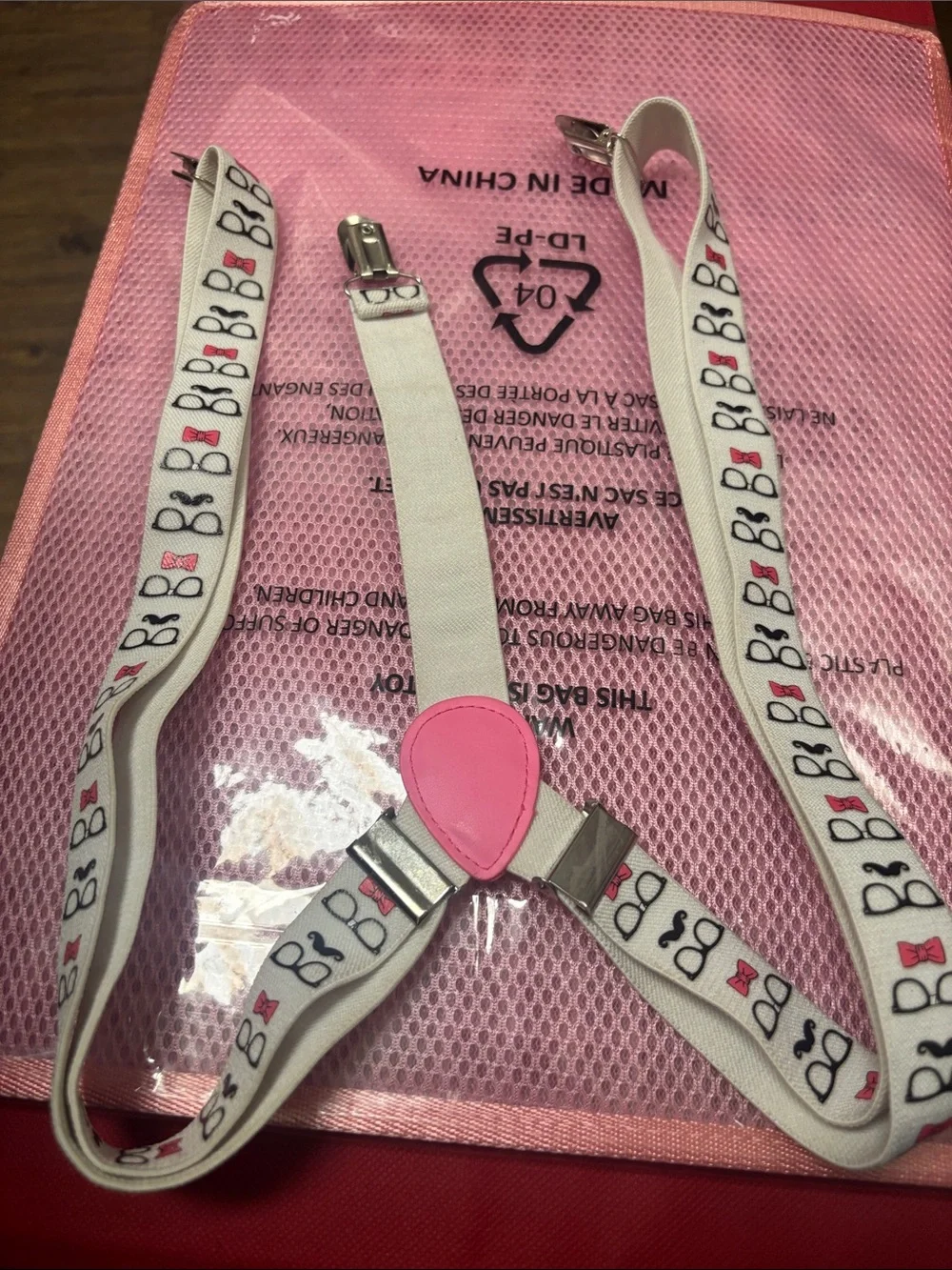 White Novelty Suspenders with Pink glasses ,bow tie and mustache Accent